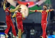 Kohli (left) took over Royal Challengers Bangalore captaincy duties from Vettori (right).